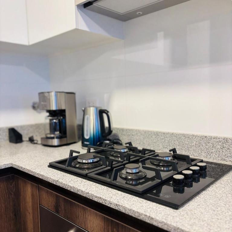 Modern and centrally located with a rooftop - One-Bedroom Apartment - 10