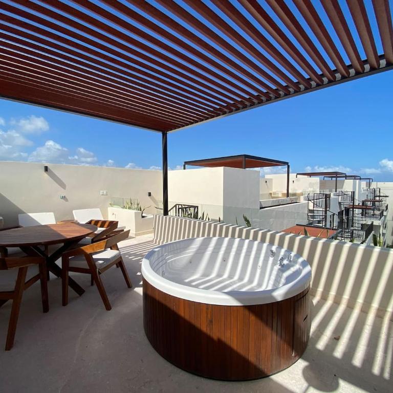 Luxe Jungle Retreat with Private Terrace & Jacuzzi in Aldea Zama - Two-Bedroom Deluxe Apartment - 2