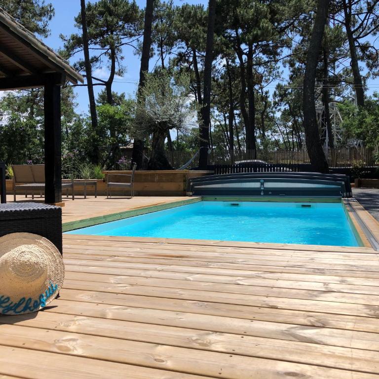 Chambre Cap-Ferret-Piscine chauffée-Villa Sylhengui - Chambre Double ou Lits Jumeaux - Vue sur Piscine - 8