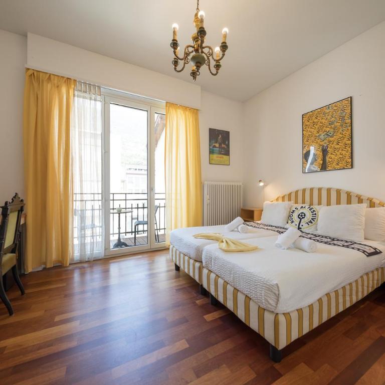 Rooms Al Festival - Camera Matrimoniale/Doppia con Letti Singoli con Bagno in Comune - 1