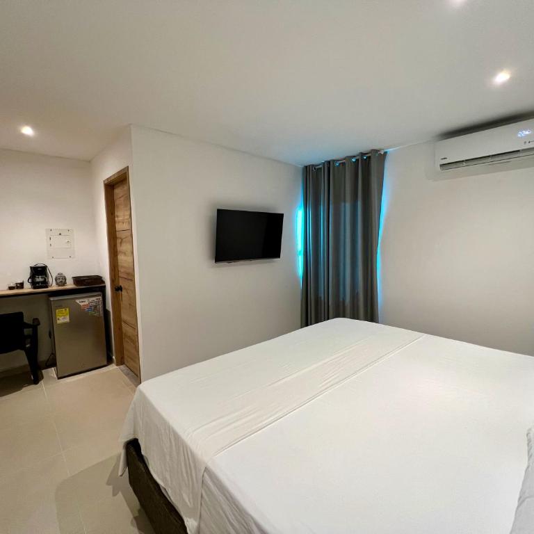 Estadero Bello Horizonte - Habitación con cama grande y vistas al jardín - 1