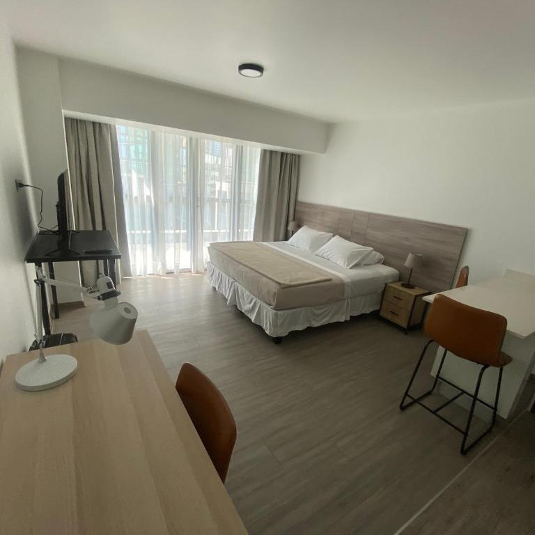Urban Suites Apart Hotel con Estacionamiento Gratuito - Studio Apartment with King Bed - 11