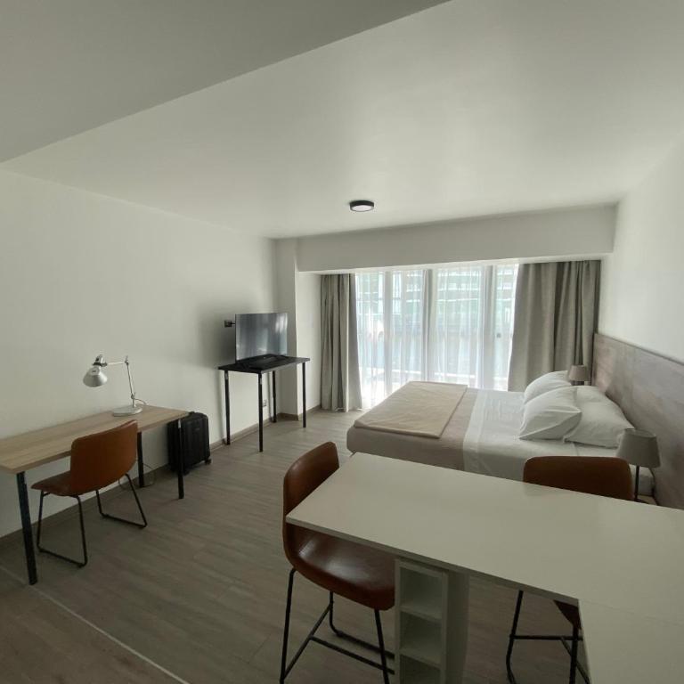 Urban Suites Apart Hotel con Estacionamiento Gratuito - Studio Apartment with King Bed - 12