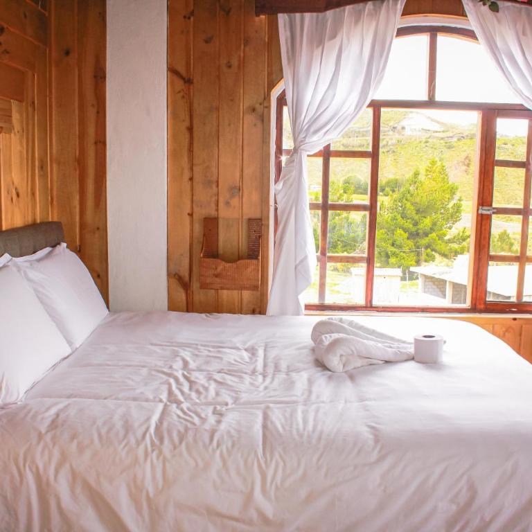 Hostería Chukirawa - Habitación con cama grande y bañera de hidromasaje - 3