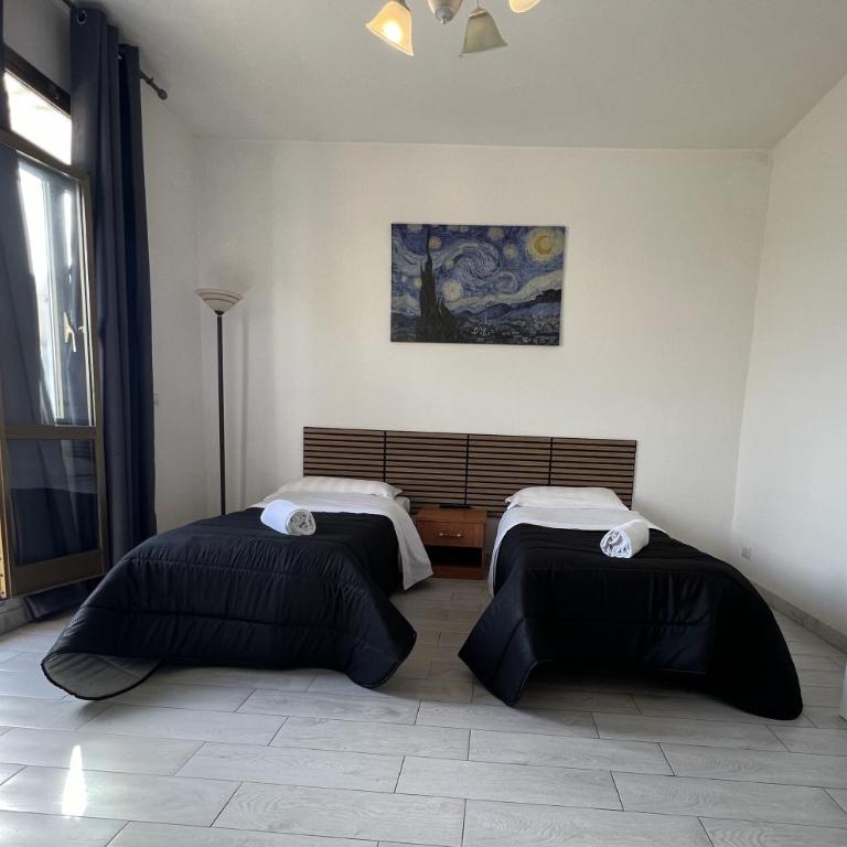 Stephany's Guesthouse - Camera Standard Doppia con Letti Singoli con Bagno in Comune - 1