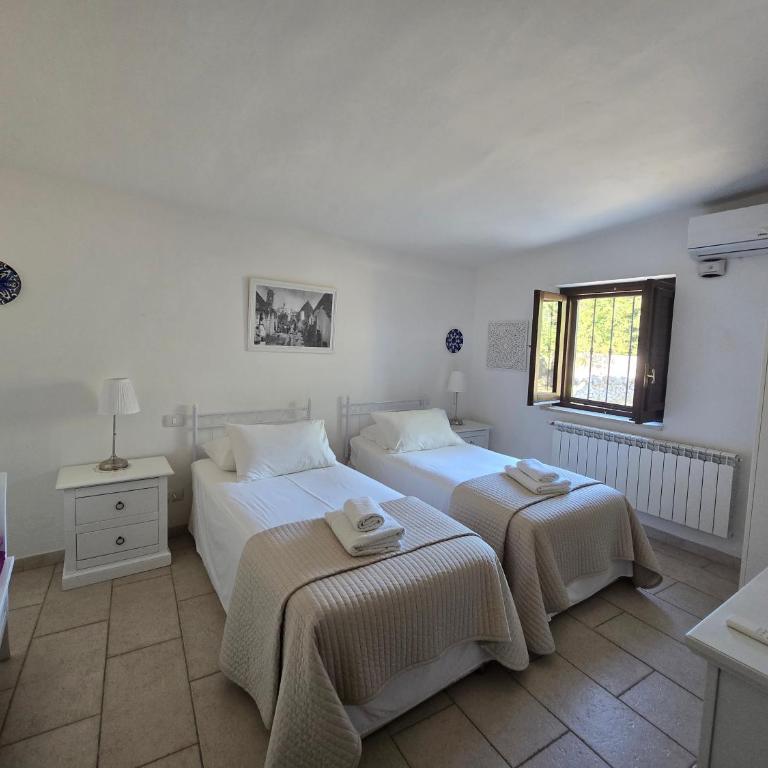 Trullo Olivia con piscina riscaldata, natura e relax - Three-Bedroom House - 16