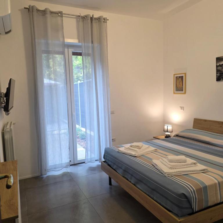 Alloggio Turistico A casa di Anna - Appartamento con 2 Camere da Letto e Vista Giardino - 5