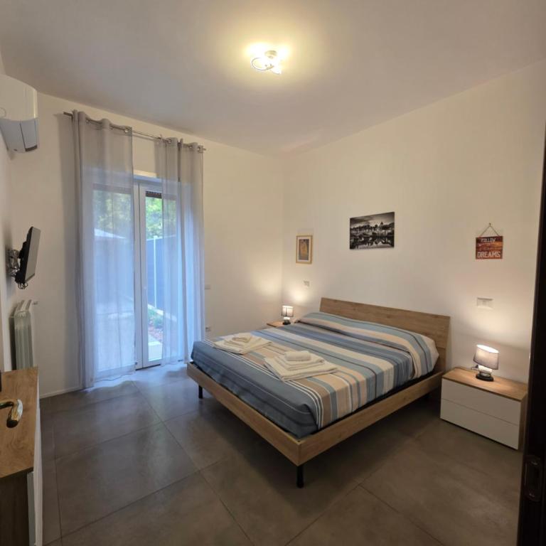 Alloggio Turistico A casa di Anna - Appartamento con 2 Camere da Letto e Vista Giardino - 1