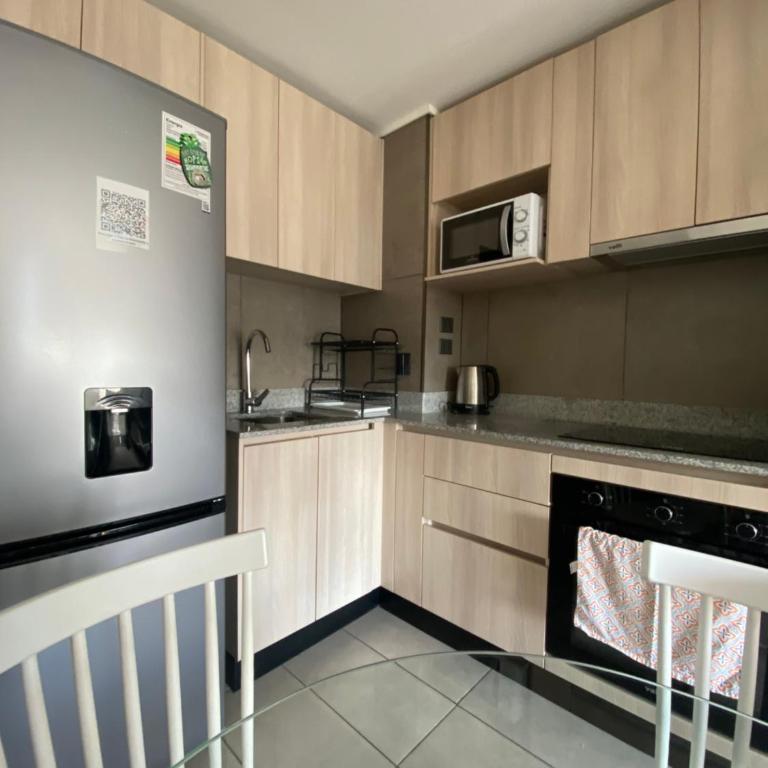 Depto 2 Dormitorios, cercano a metros, malls, clínicas, supermercados y servicios - Apartamento de 2 dormitorios - 31