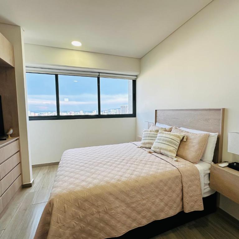 Modern 2BR Condo in Providencia, City Views, Pool & Gym - Two-Bedroom Deluxe Apartment with Balcony - 13