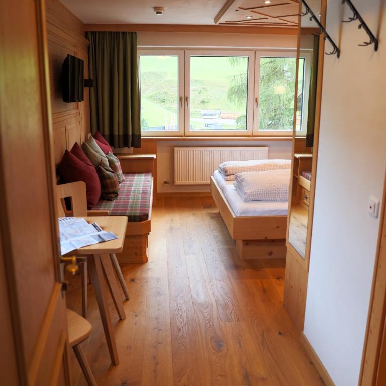 Pension Muggengrat - Doppelzimmer mit Zustellbett - 19