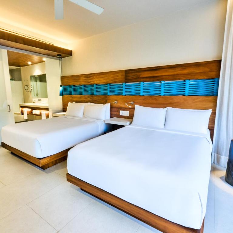 Devossion By Live Aqua Playa del Carmen All Inclusive - Adults Only - Habitación Premium con 2 camas grandes y vistas parciales al mar - 5