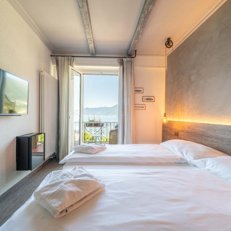 Seven Boutique Hotel - Camera Matrimoniale con Vista Lago e Balcone - 15