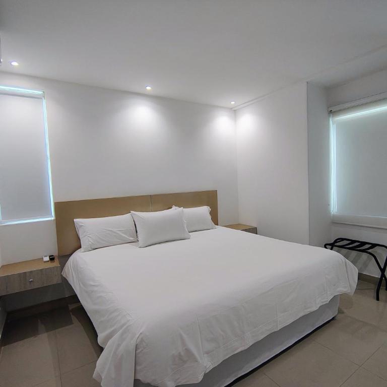 Apartamentos Amoblados-Atlantis Suites Bquilla - Habitación Deluxe con cama extragrande - 8