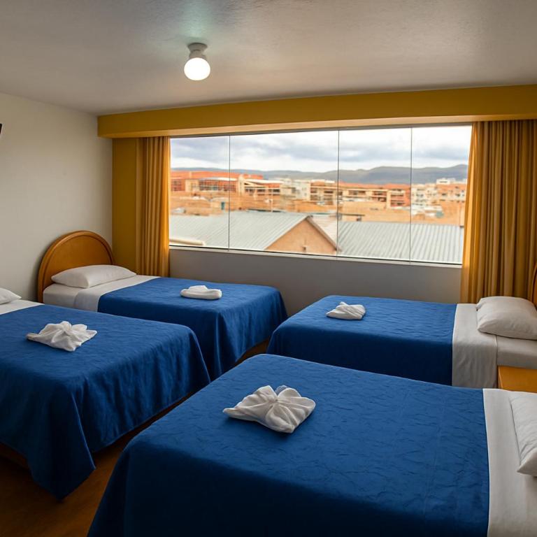 HOSTAL ACUARIUS PUNO - Habitación Cuádruple con baño - 2