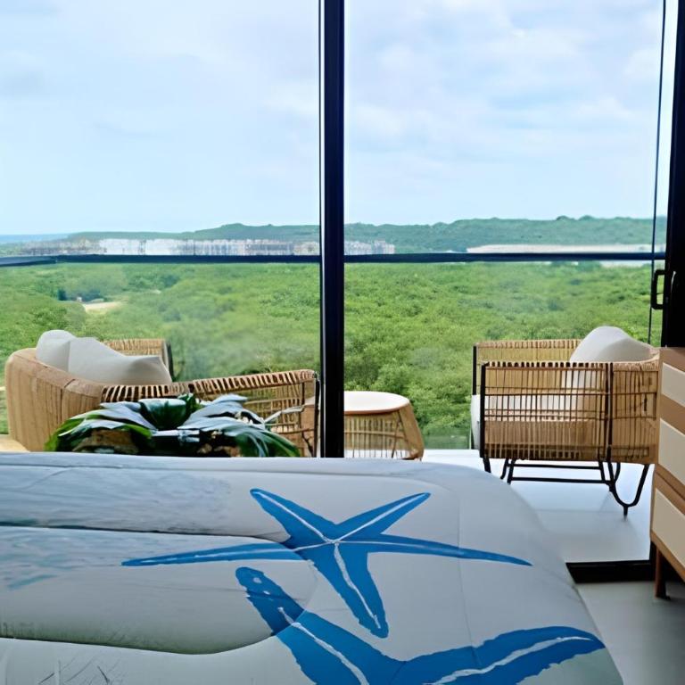 ¡Comodidad y Estilo frente al mar! - Deluxe Two-Bedroom Apartment with Garden View - 3