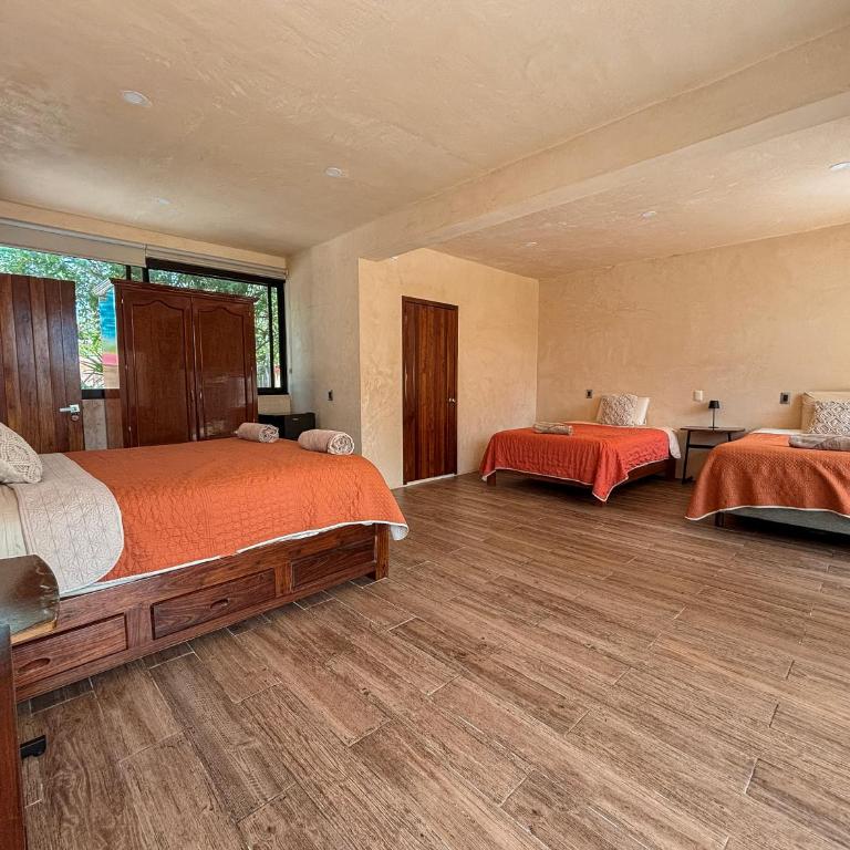 Villas Mandarina Bacalar - Habitación Triple con vistas al jardín - 3