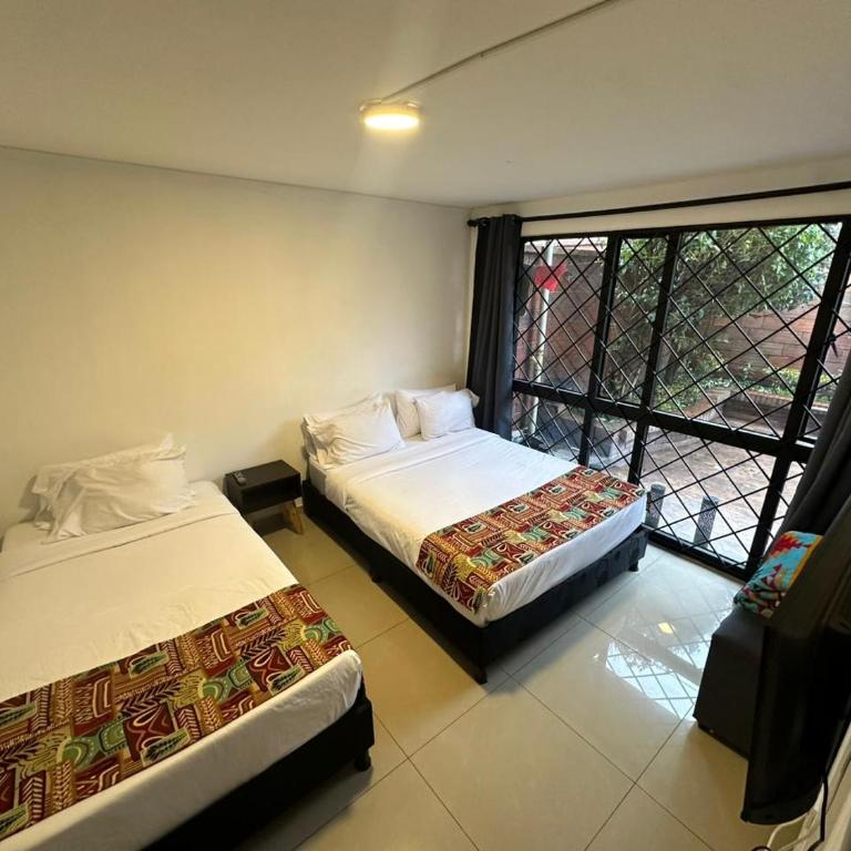 Bamuka Hostal - Habitación Familiar Estándar - 3