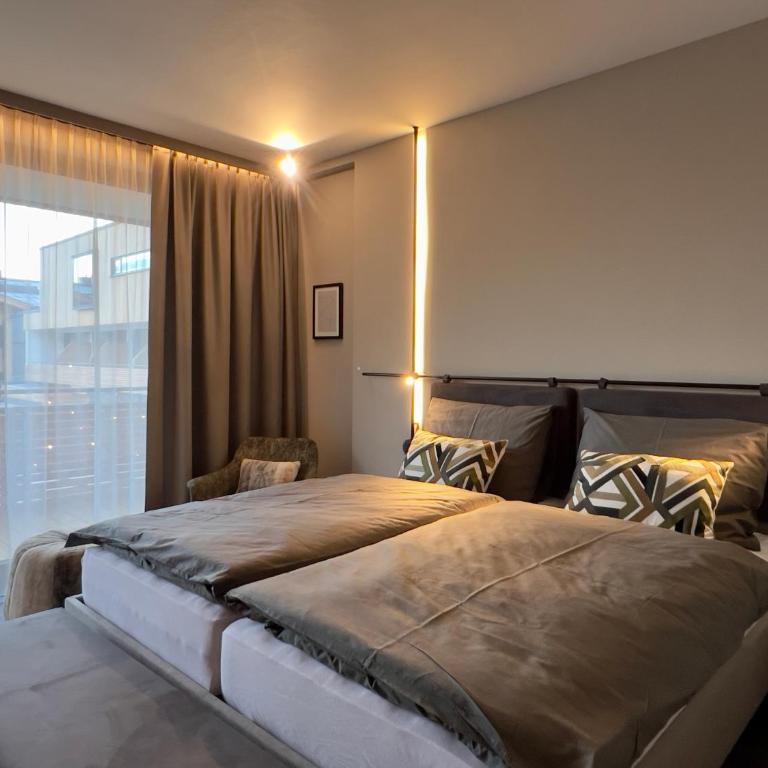 Revier Boutique Hotel Kaprun - Zimmer mit Kingsize-Bett und Gartenblick. - 1