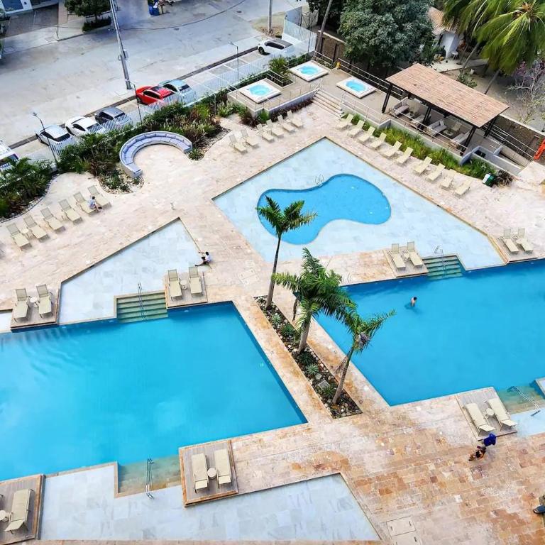 Apto con Vista al Mar, Piscinas, jacuzzis y club de playa en Reserva del Mar - Apartment - 32