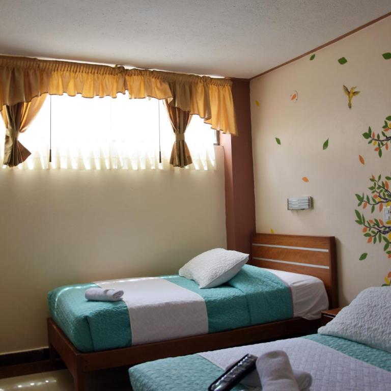 Hostal Dulce Amanecer - Habitación Cuádruple Dúplex - 10