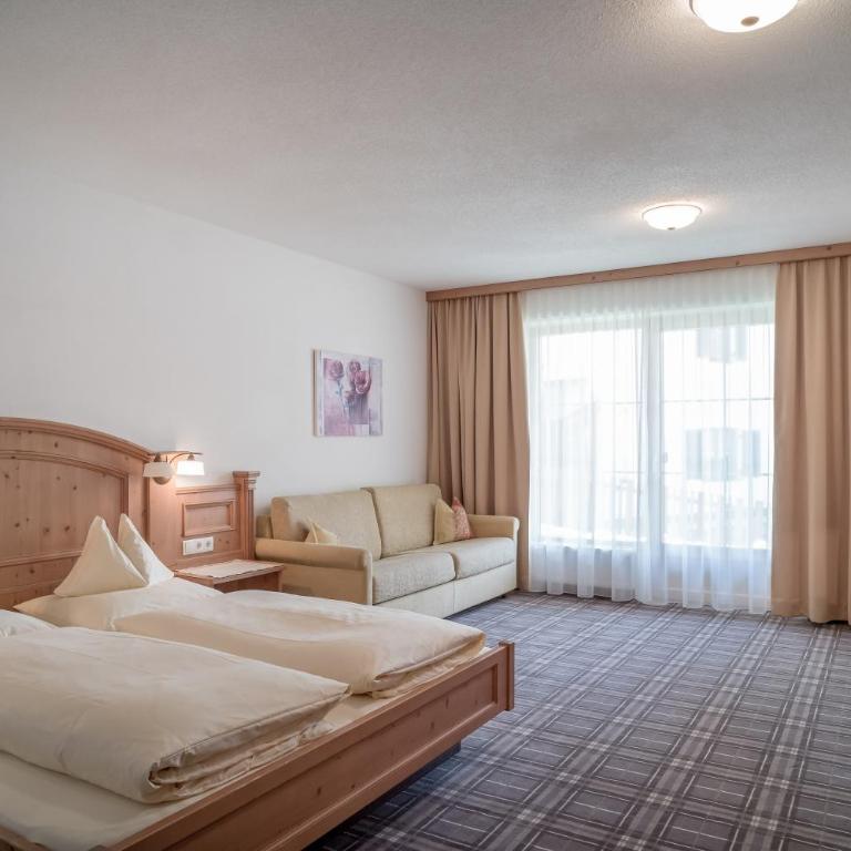 Hotel Garni Alpenresidenz Zimmer & Aparts - Deluxe Apartment mit 1 Schlafzimmer und Gartenblick - 2