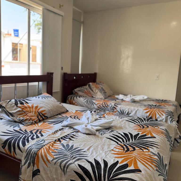 Hostal la 200 - Habitación Doble con baño privado - 2 camas - 4