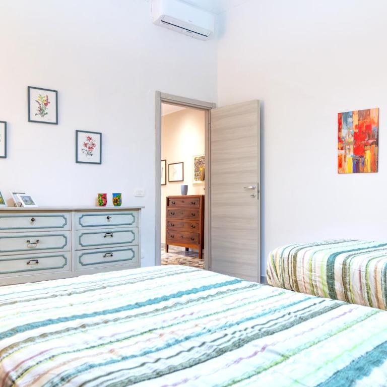 Domus Mazzini Pisa Centro - 6 Ospiti, 2 Bagni, 3 Camere, Patio Privato - 5 minuti dalla Stazione Treni - Appartamento con 3 Camere da Letto - 29