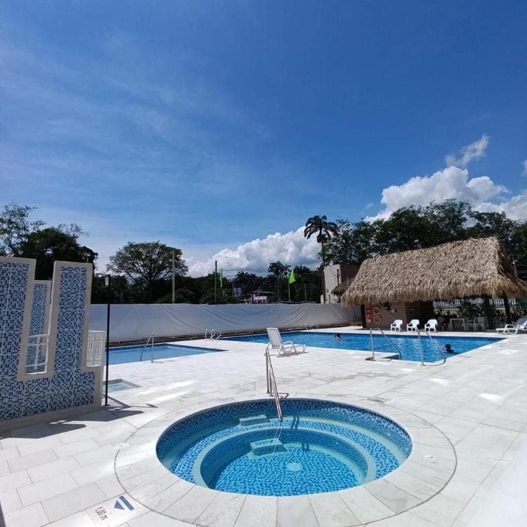 2 Piscinas en condominio y BBQ privado - Three-Bedroom Apartment - 31