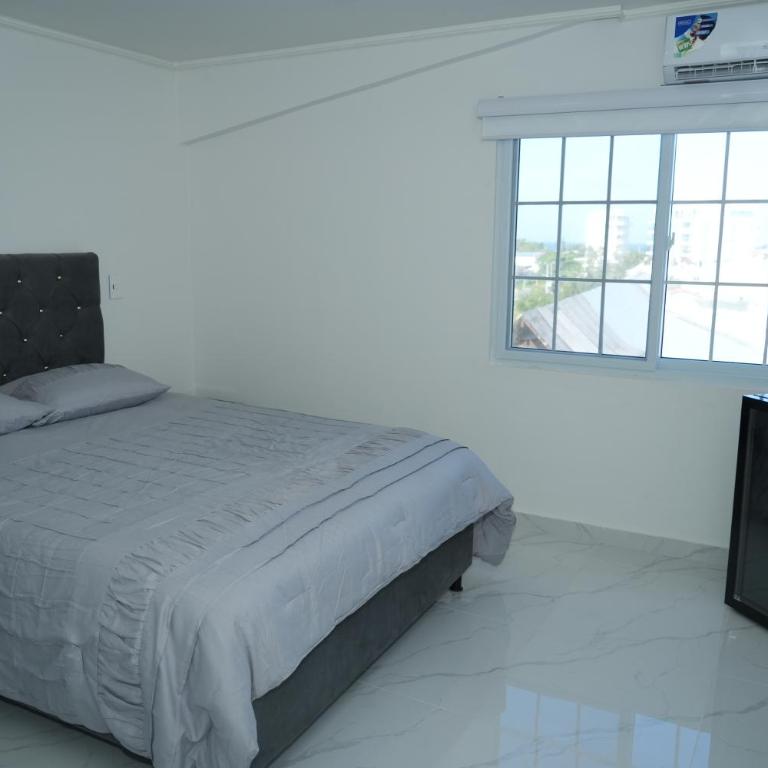 Jhonny Cay Suites - Habitación Cuádruple - vistas al jardín - 1