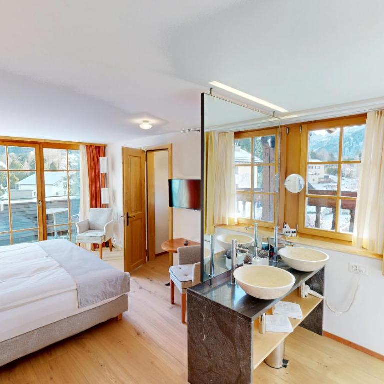 Schweizerhaus Swiss Quality Hotel - Deluxe Doppelzimmer mit Bergblick - 7
