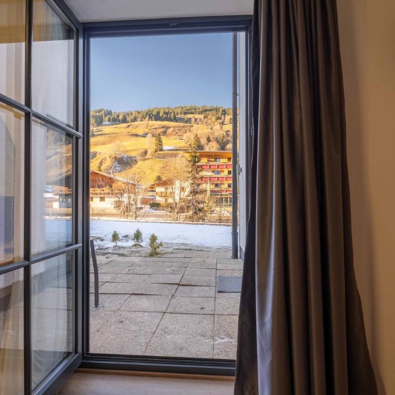 Alpenglück Apartments by we rent, JOKERCARD INCLUDED - Two-Bedroom Apartment with Garden View - 19