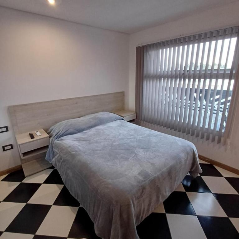 Garden Block Departamentos Temporarios - Estudio Deluxe con cama grande - 14