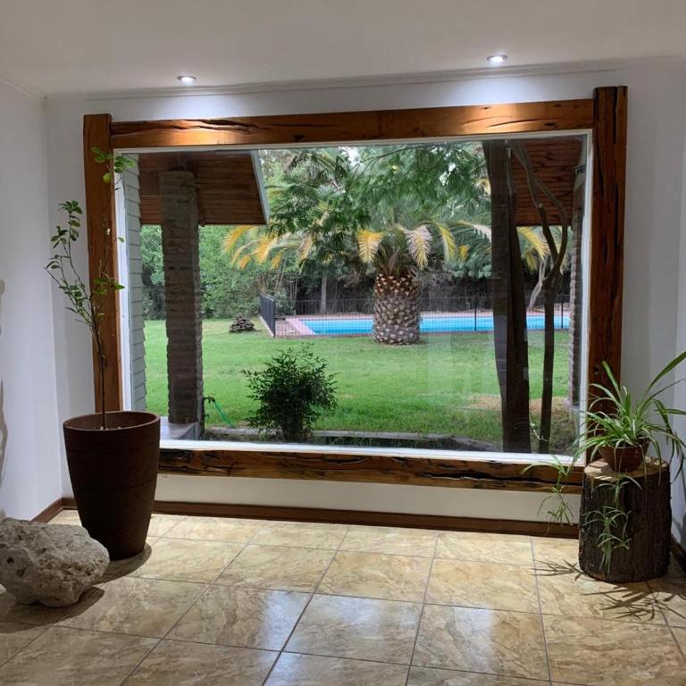 Parcela con Casa, Terraza, Piscina y Quincho en Pirque - Four-Bedroom House - 1