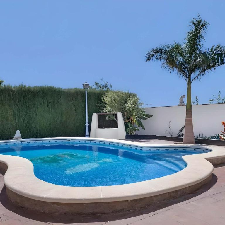 Casa con piscina compartida en Conil de la Frontera - Apartamento - 1