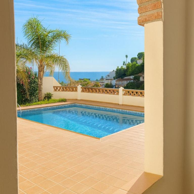 Gran terraza con vistas al mar, piscina y parking privado - Apartamento de 2 dormitorios - 12