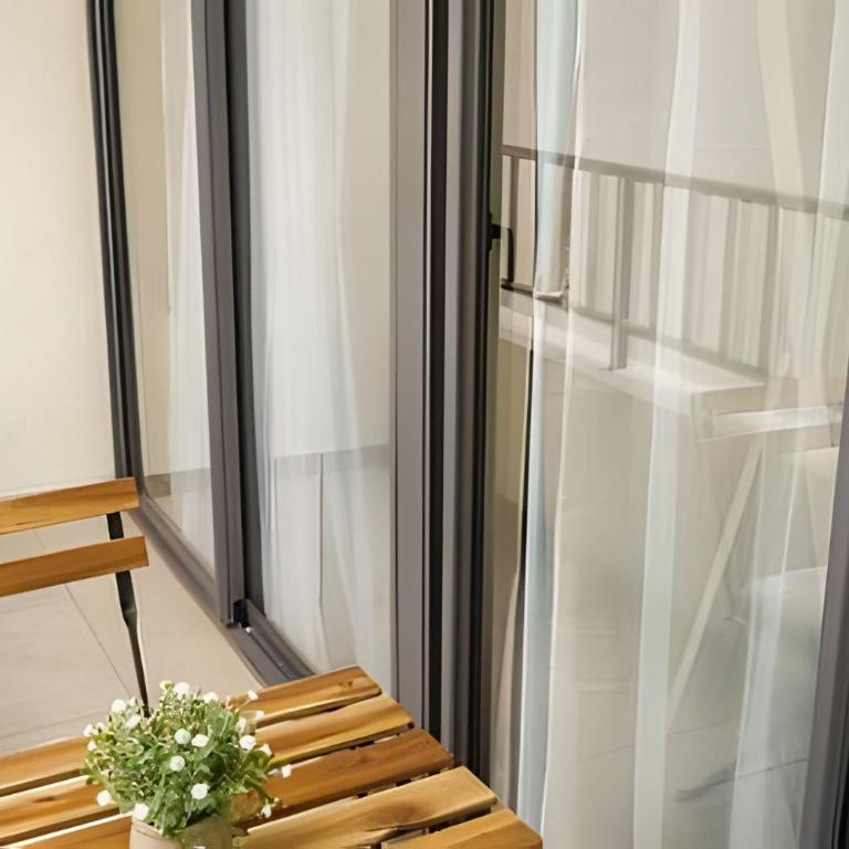 Modern Apartment with Terrace | Steps from Movistar Arena & Barrio Universitario | Up to 4 Guests - One-Bedroom Apartment with Balcony - 32