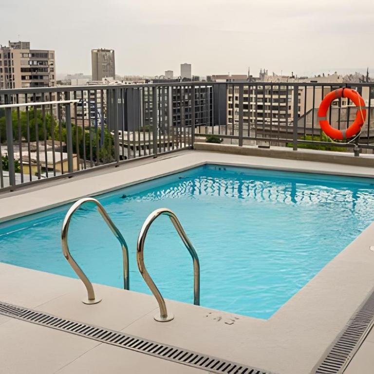 Modern Apartment with Terrace | Steps from Movistar Arena & Barrio Universitario | Up to 4 Guests - One-Bedroom Apartment with Balcony - 4