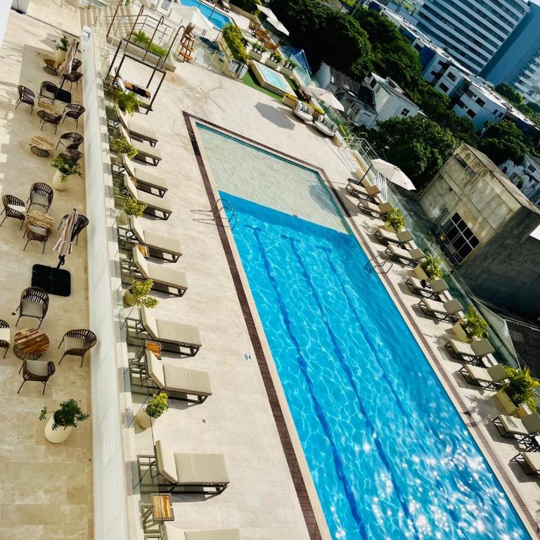 Lovely Suite steps away from the airport and sea - One-Bedroom Apartment with Pool View - 19