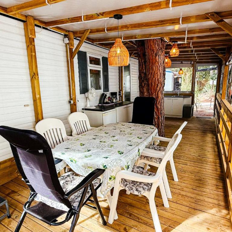 Chalets with kitchen outside at Camping Leï Suves - JoyCasa - Chalet - 5