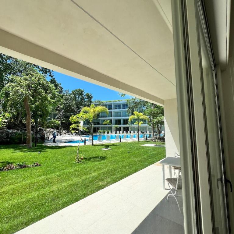 Luxurious Condo with Poolside Patio - Two-Bedroom Apartment with Pool View - 14
