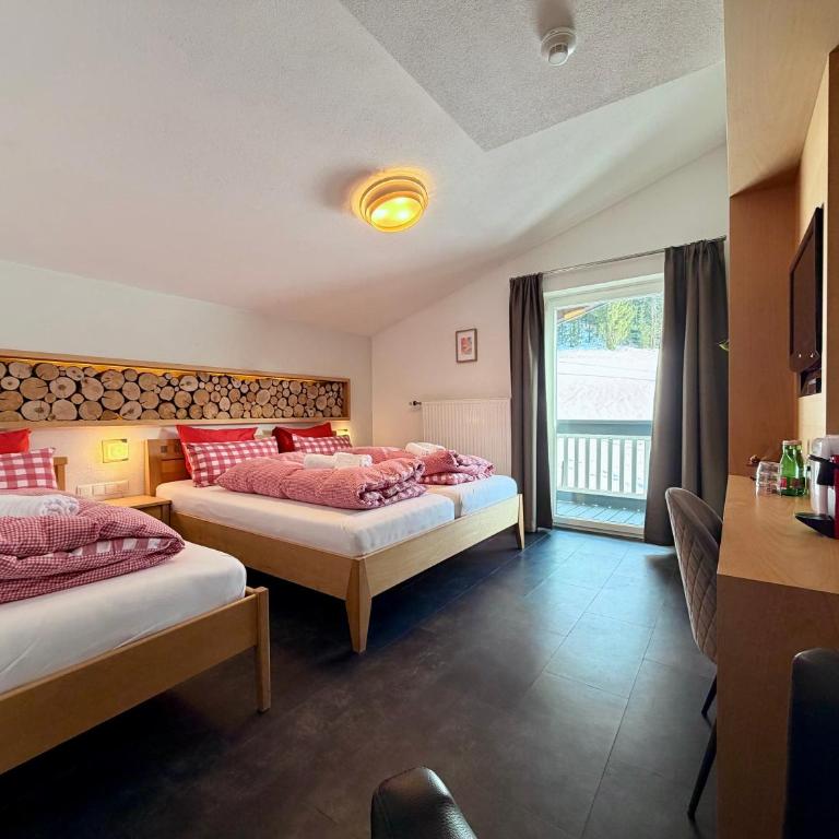 Boutique Hotel Alpenhof - Deluxe Dreibettzimmer - 1