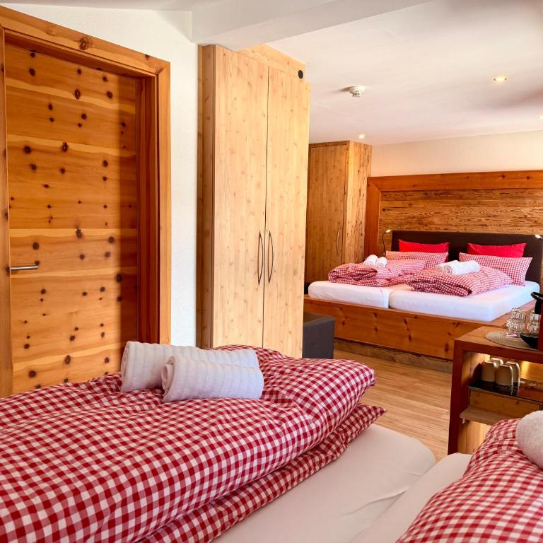 Boutique Hotel Alpenhof - Superior Vierbettzimmer - 6