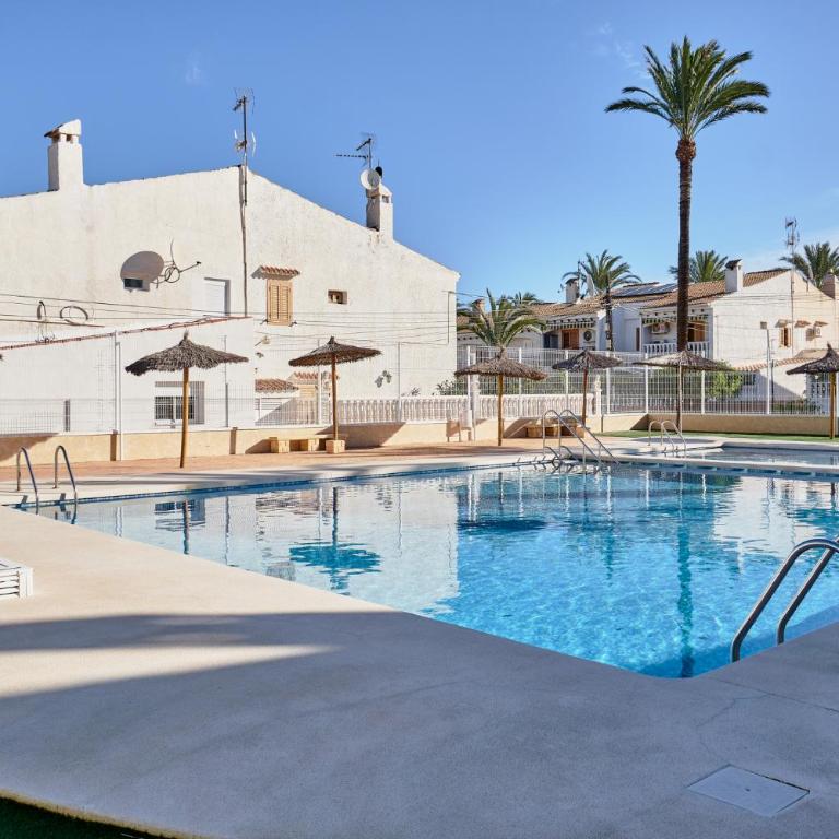Sunny Coastal Retreat with Pool & Terrace - Two-Bedroom Apartment - 10