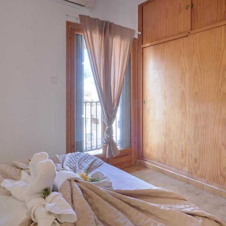 Sunny Coastal Retreat with Pool & Terrace - Two-Bedroom Apartment - 17