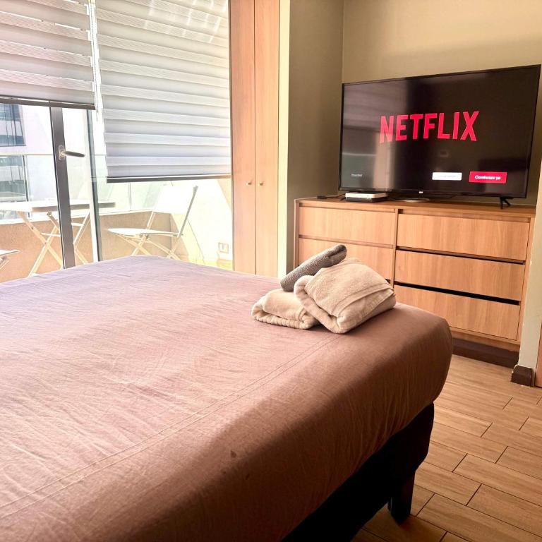 Comodo con aire acondicionado y estacionamiento - Apartment - 2