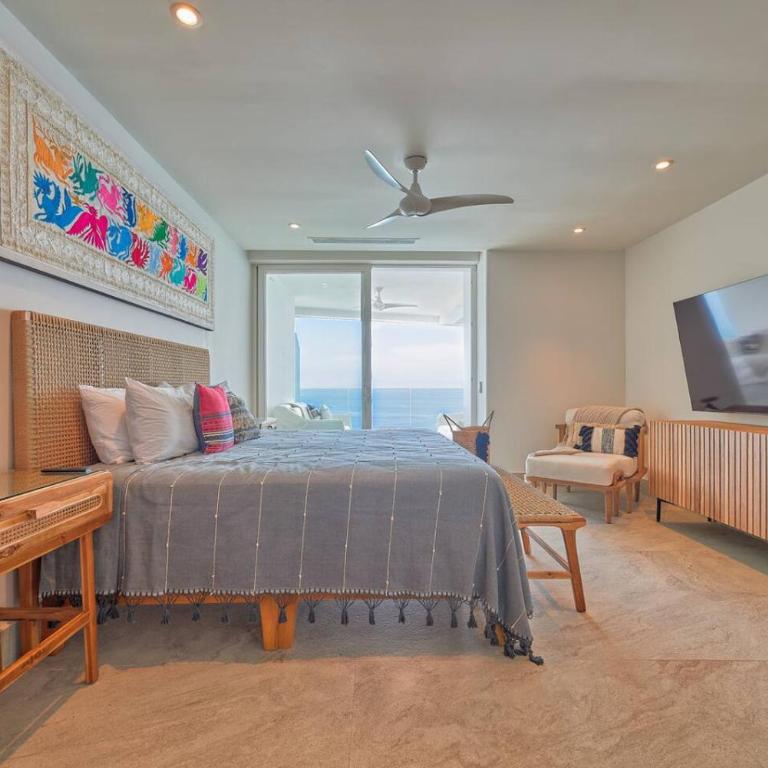 Sunset Getaway with Oceanfront Terrace and Resort Perks - Apartment - 13