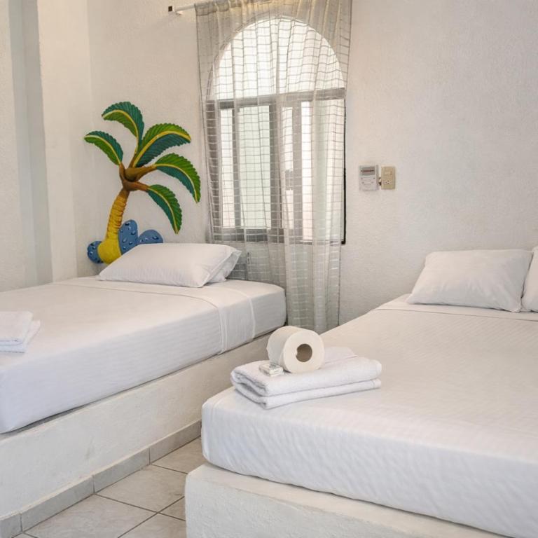 Kaia Beach Hotel - Habitación Doble con baño privado - 2 camas - 6
