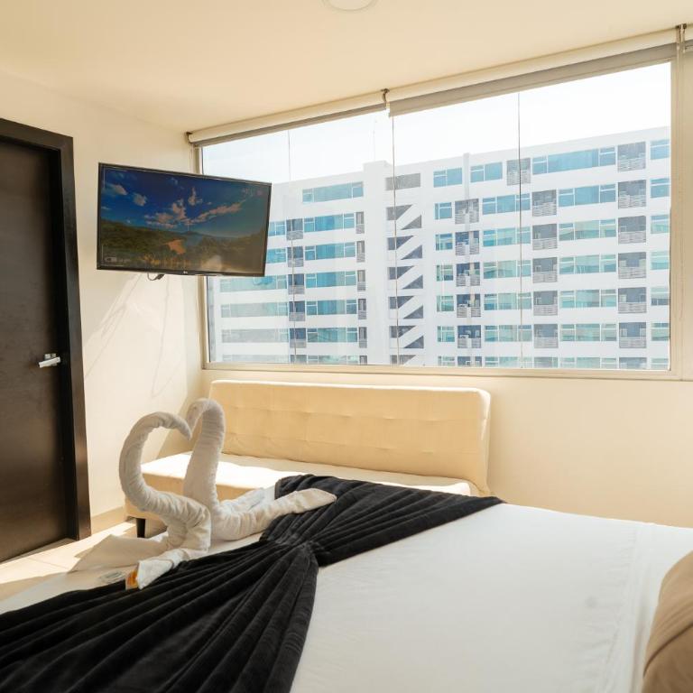 Departamento de 2 habitaciones frente a Mall del Sol - 5 min del aeropuerto - Two-Bedroom Apartment - 40