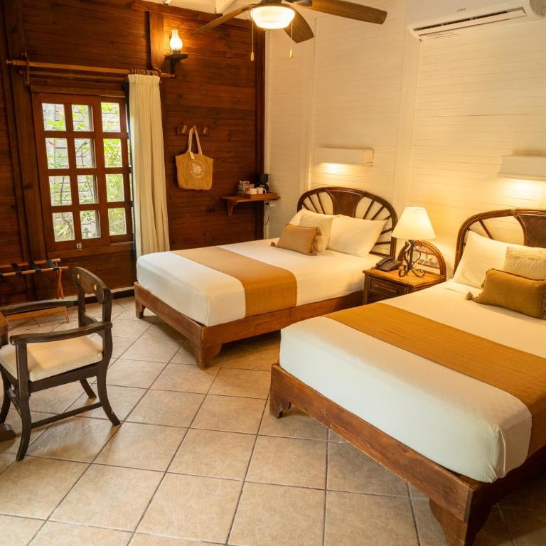 Petit Lafitte Beach Front Hotel & Bungalows - Palm Beach Bungalow - 2 Double Beds - 1